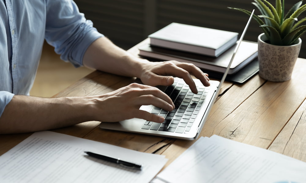 man using laptop and doing research